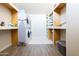 Convenient laundry area with washer, dryer and storage at 2230 N 87Th Ter, Scottsdale, AZ 85257