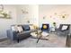 Open living room with gray sofa and blue armchairs at 2230 N 87Th Ter, Scottsdale, AZ 85257