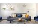 Cozy living room featuring a gray sofa and decorative pillows at 2230 N 87Th Ter, Scottsdale, AZ 85257
