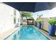 Relaxing pool area with blue umbrellas at 2230 N 87Th Ter, Scottsdale, AZ 85257