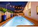 Luminous pool at night with unicorn floatie at 2230 N 87Th Ter, Scottsdale, AZ 85257