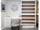 White built-in shelving with wood shelves for storage at 2230 N 87Th Ter, Scottsdale, AZ 85257