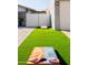 Artificial turf side yard with cornhole game at 2230 N 87Th Ter, Scottsdale, AZ 85257