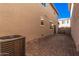 Small backyard with brick pavers and an AC unit at 2405 N 73Rd Dr, Phoenix, AZ 85035