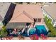 Aerial view of a home featuring a pool, pergola-covered patio, and well-maintained landscaping at 267 E Santa Lucia Ln, Queen Creek, AZ 85140