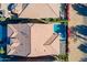 Overhead view of a home with a well-maintained backyard featuring a pool, patio, and lush landscaping at 267 E Santa Lucia Ln, Queen Creek, AZ 85140