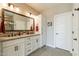 Bathroom with a double vanity, modern fixtures, and a large mirror at 267 E Santa Lucia Ln, Queen Creek, AZ 85140
