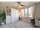 Bright bedroom featuring a white Murphy bed, a large window, and a stylish area rug at 267 E Santa Lucia Ln, Queen Creek, AZ 85140