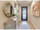 Inviting entryway featuring a decorative mirror, stylish console table, and views into living spaces at 267 E Santa Lucia Ln, Queen Creek, AZ 85140