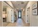 Inviting hallway with neutral tones and decorative accents, leading to various rooms in the home at 267 E Santa Lucia Ln, Queen Creek, AZ 85140