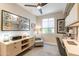 Bright home office featuring a modern desk, natural light, and comfortable seating at 267 E Santa Lucia Ln, Queen Creek, AZ 85140