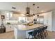 Bright, modern kitchen featuring an expansive island with sleek countertops and stainless steel appliances at 267 E Santa Lucia Ln, Queen Creek, AZ 85140