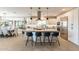 Open kitchen with a large island, modern appliances, and a view of the dining and living areas at 267 E Santa Lucia Ln, Queen Creek, AZ 85140