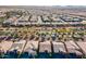 Aerial view of a suburban neighborhood showcasing well-maintained homes, lush landscaping, and tree-lined streets at 267 E Santa Lucia Ln, Queen Creek, AZ 85140