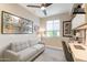 Bright and well-lit office space featuring a comfortable couch, desk, and stylish decor at 267 E Santa Lucia Ln, Queen Creek, AZ 85140
