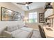 Bright and well-lit office space featuring a comfortable couch, desk, and stylish decor at 267 E Santa Lucia Ln, Queen Creek, AZ 85140