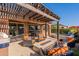 Beautiful outdoor patio with a built-in BBQ, comfortable seating, and a fire pit, perfect for entertaining at 267 E Santa Lucia Ln, Queen Creek, AZ 85140