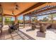 Expansive covered patio featuring an outdoor dining area, comfortable lounge seating, and a built-in BBQ at 267 E Santa Lucia Ln, Queen Creek, AZ 85140