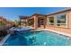 Inviting backyard pool and spa with covered patio, perfect for entertaining and relaxation at 267 E Santa Lucia Ln, Queen Creek, AZ 85140