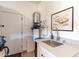 Functional utility room with a sink, modern water heater, and ample counter space at 267 E Santa Lucia Ln, Queen Creek, AZ 85140