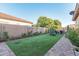 Landscaped backyard with artificial turf and garden at 2827 E Bellerive Dr, Gilbert, AZ 85298