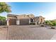 Beautiful home exterior with three car garage and paver driveway at 2827 E Bellerive Dr, Gilbert, AZ 85298