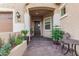 Elegant entryway with a wrought-iron door and lush landscaping at 2827 E Bellerive Dr, Gilbert, AZ 85298