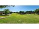 Landscaped greenbelt with lush grass and mature trees at 2827 E Bellerive Dr, Gilbert, AZ 85298