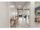 Inviting hallway leads to living area with a tiled floor and neutral colored walls at 2827 E Bellerive Dr, Gilbert, AZ 85298