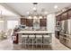Modern kitchen features a large island with seating, stainless steel appliances, and pendant lighting at 2827 E Bellerive Dr, Gilbert, AZ 85298