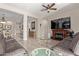 Relaxing living room with fireplace and large TV at 2827 E Bellerive Dr, Gilbert, AZ 85298