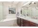 This main bathroom offers a soaking tub, dual sinks, and walk-in shower at 2827 E Bellerive Dr, Gilbert, AZ 85298
