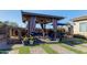 Relaxing covered patio with comfortable seating and fireplace at 2827 E Bellerive Dr, Gilbert, AZ 85298