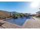 Relaxing pool area with brick patio and umbrellas at 2827 E Bellerive Dr, Gilbert, AZ 85298