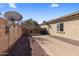 Backyard with a brick paver patio, gravel, and block wall at 2832 E Flower St, Gilbert, AZ 85298