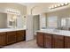 Double vanity bathroom with a large mirror and tile flooring at 2832 E Flower St, Gilbert, AZ 85298