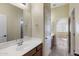 Bathroom with single sink vanity and access to another room at 2832 E Flower St, Gilbert, AZ 85298