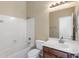 Clean bathroom with tub, toilet and vanity with sink at 2832 E Flower St, Gilbert, AZ 85298