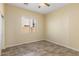 Simple bedroom with tile flooring and window with blinds at 2832 E Flower St, Gilbert, AZ 85298