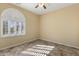 Bright bedroom featuring an arched window with shutters at 2832 E Flower St, Gilbert, AZ 85298
