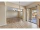 Open dining area with tile flooring and access to the backyard patio at 2832 E Flower St, Gilbert, AZ 85298