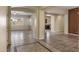 Spacious entryway with tile flooring, offering views into the living and dining areas at 2832 E Flower St, Gilbert, AZ 85298