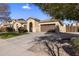 Single-story home with a two-car garage and landscaped front yard at 2832 E Flower St, Gilbert, AZ 85298