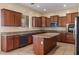 Bright kitchen featuring an island, ample cabinetry, and granite countertops at 2832 E Flower St, Gilbert, AZ 85298
