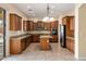 Spacious kitchen with island, granite counters, and stainless steel appliances at 2832 E Flower St, Gilbert, AZ 85298