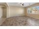 Bright living room with tile floors and a ceiling fan at 2832 E Flower St, Gilbert, AZ 85298