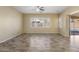 Large living room with tile floors, ceiling fan and access to backyard at 2832 E Flower St, Gilbert, AZ 85298