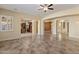 Open living area with tile floors and views of kitchen and dining areas at 2832 E Flower St, Gilbert, AZ 85298