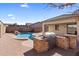 Backyard oasis with a pool and built-in grilling station at 2832 E Flower St, Gilbert, AZ 85298