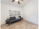 Bright guest room with a futon and wood-look floors at 2835 E Athena Ct, Gilbert, AZ 85297